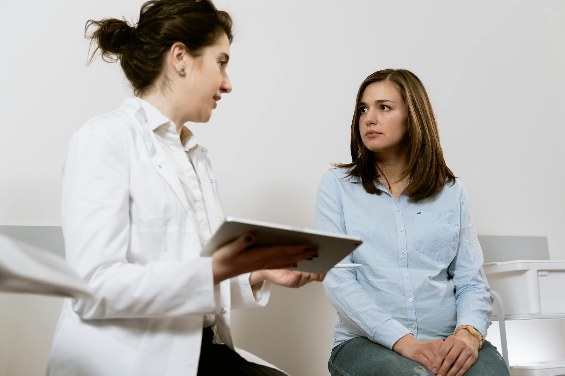 Doctor reviewing AI diagnostic data on screen